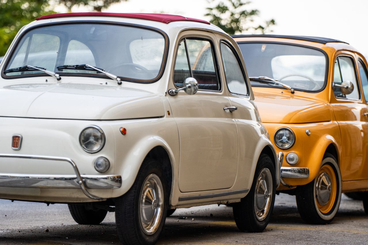 showroom Vintage Fiat 500 cars in Corfu, Greece showcasing classic design and vibrant colors.