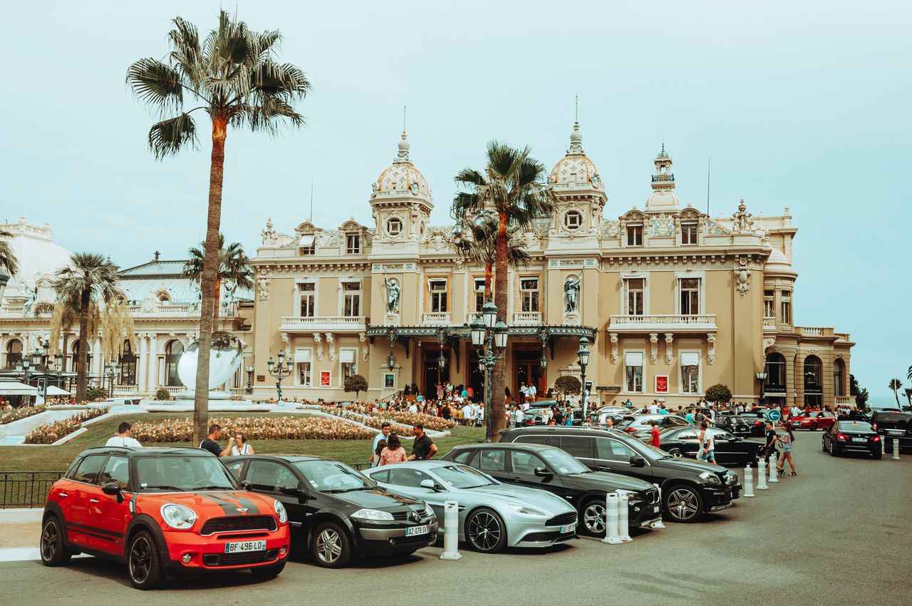 showroom Cars parked in front of Monte Carlo Casino, a blend of luxury and architectural grandeur.